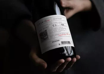 How do you open a wine without a bottle opener?