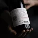How do you open a wine without a bottle opener?
